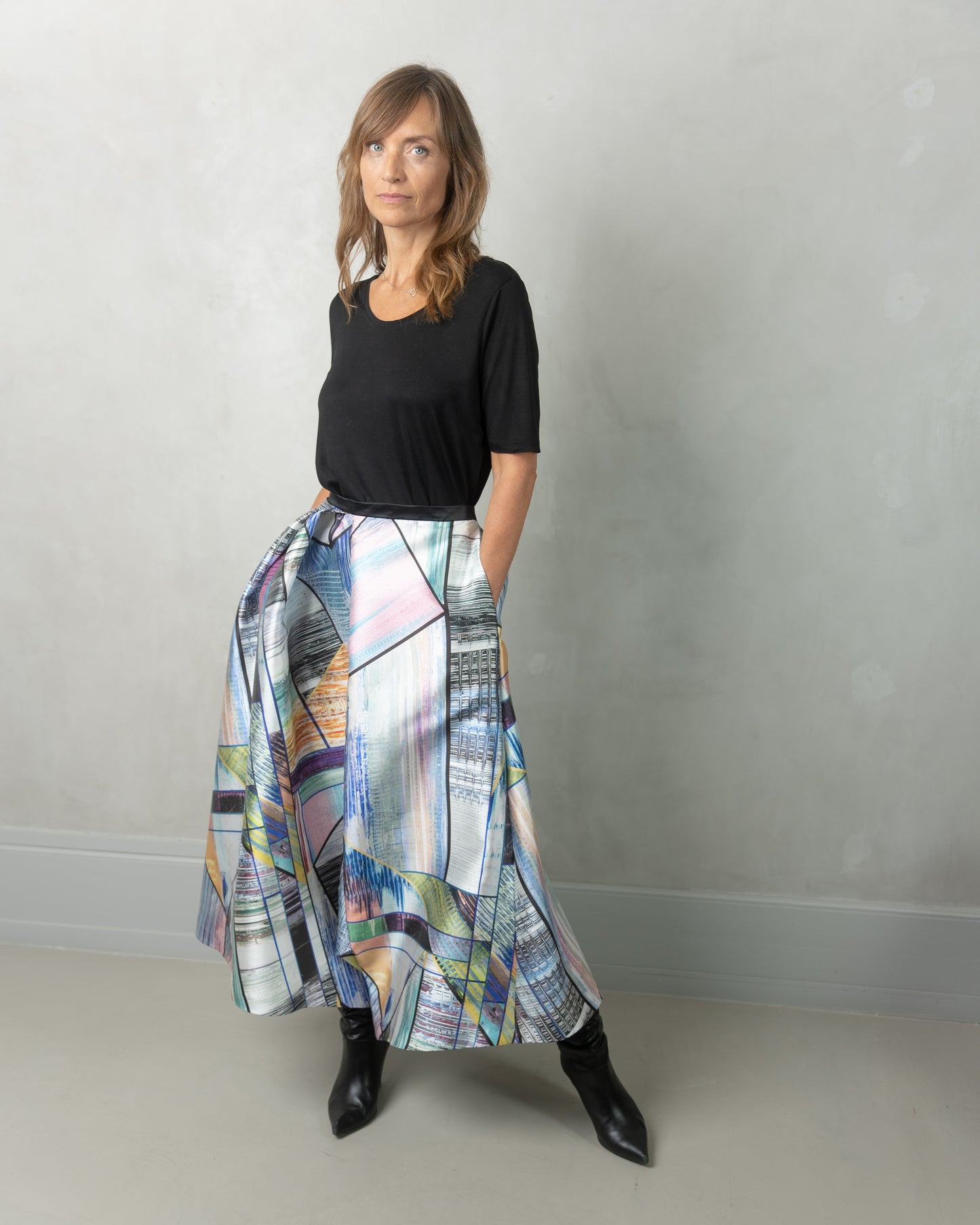 Model wearing Alayan skirt, long city break & own black t-shirt.