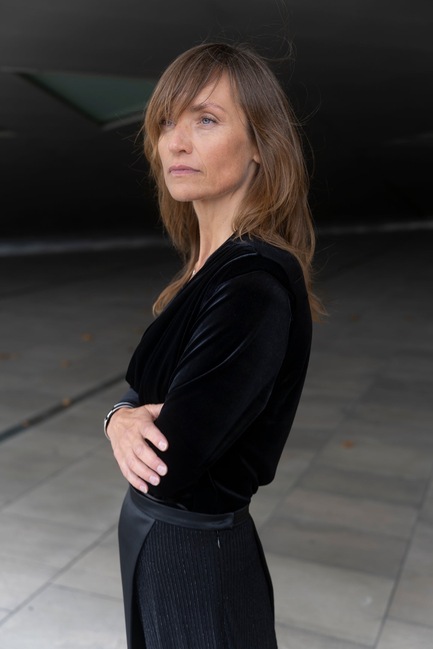 Woman wearing Alek top mathced with Aya skirt - all in black.