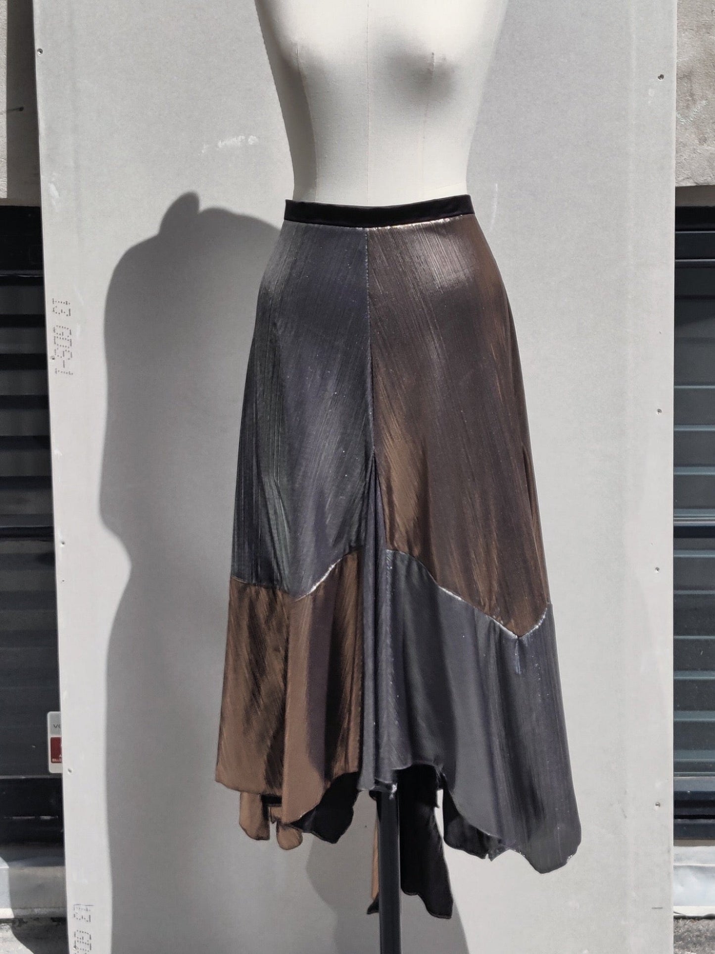 Alyza skirt, chess, hanging on a dummy.