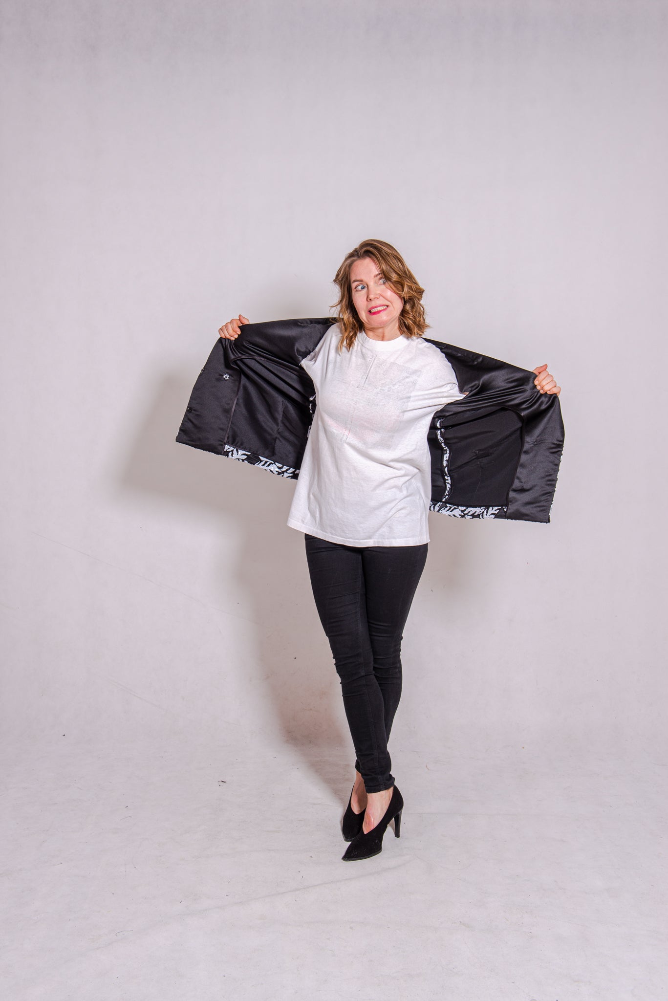 Woman wearing Alison - a double-breasted sequin gilet.