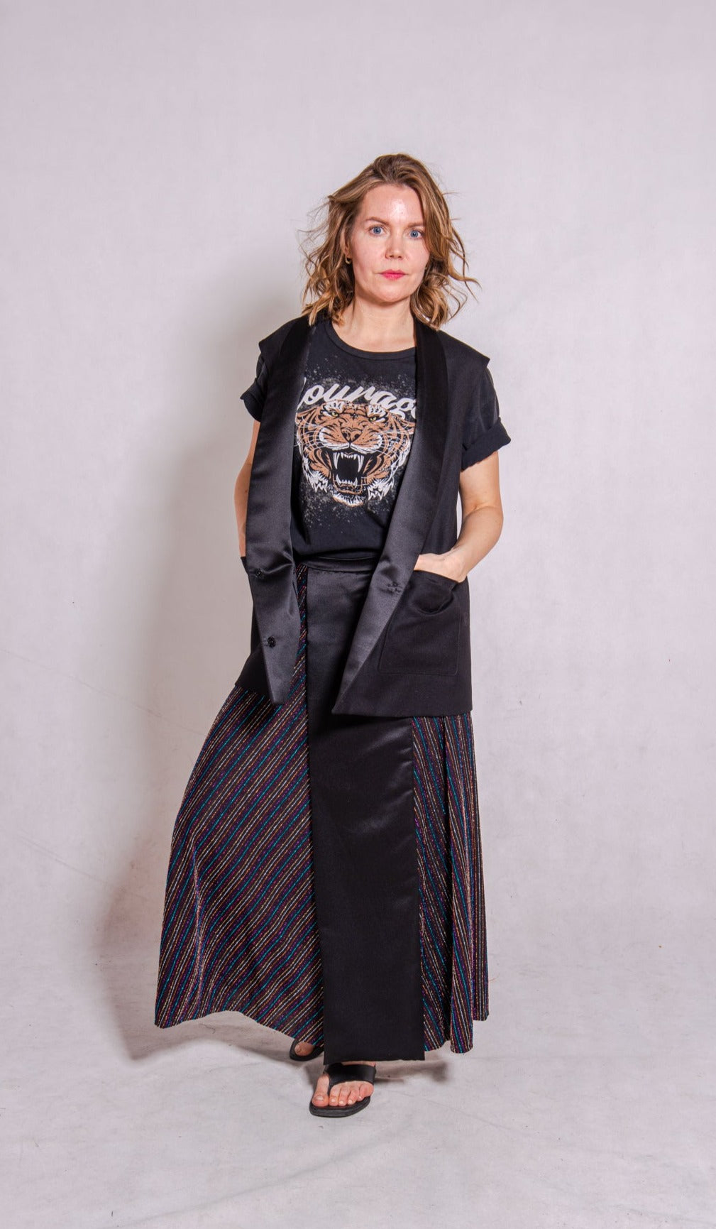 Model wears Ailo top, multi stripey, and Aya skirt, stripey multi.