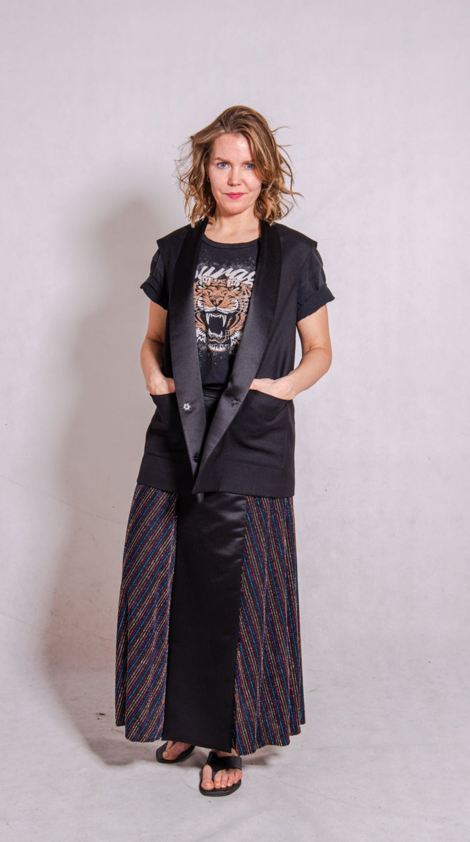 Model wears Ailo top, multi stripey, and Aya skirt, stripey multi.
