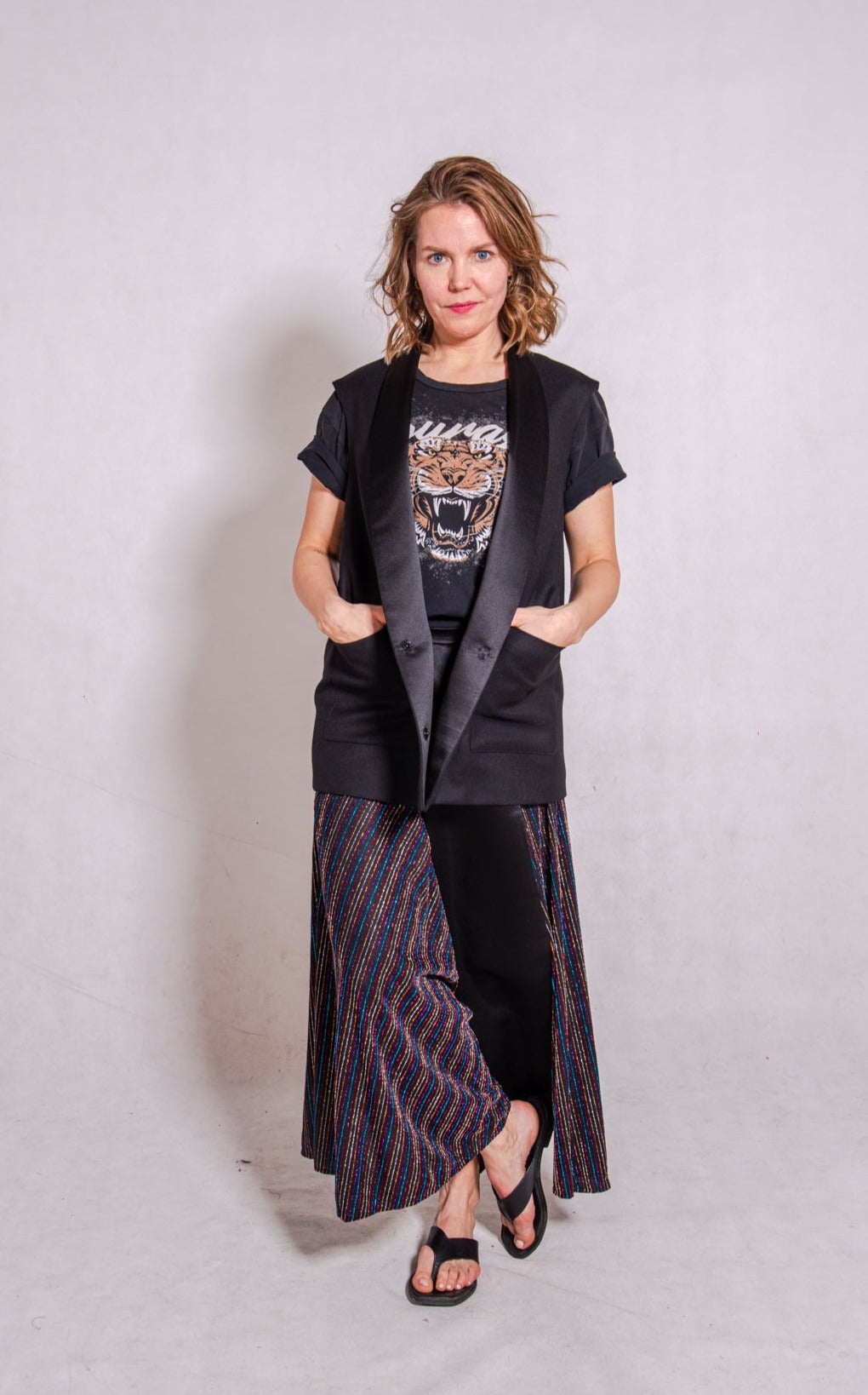 Model wears Ailo top, multi stripey, and Aya skirt, stripey multi.