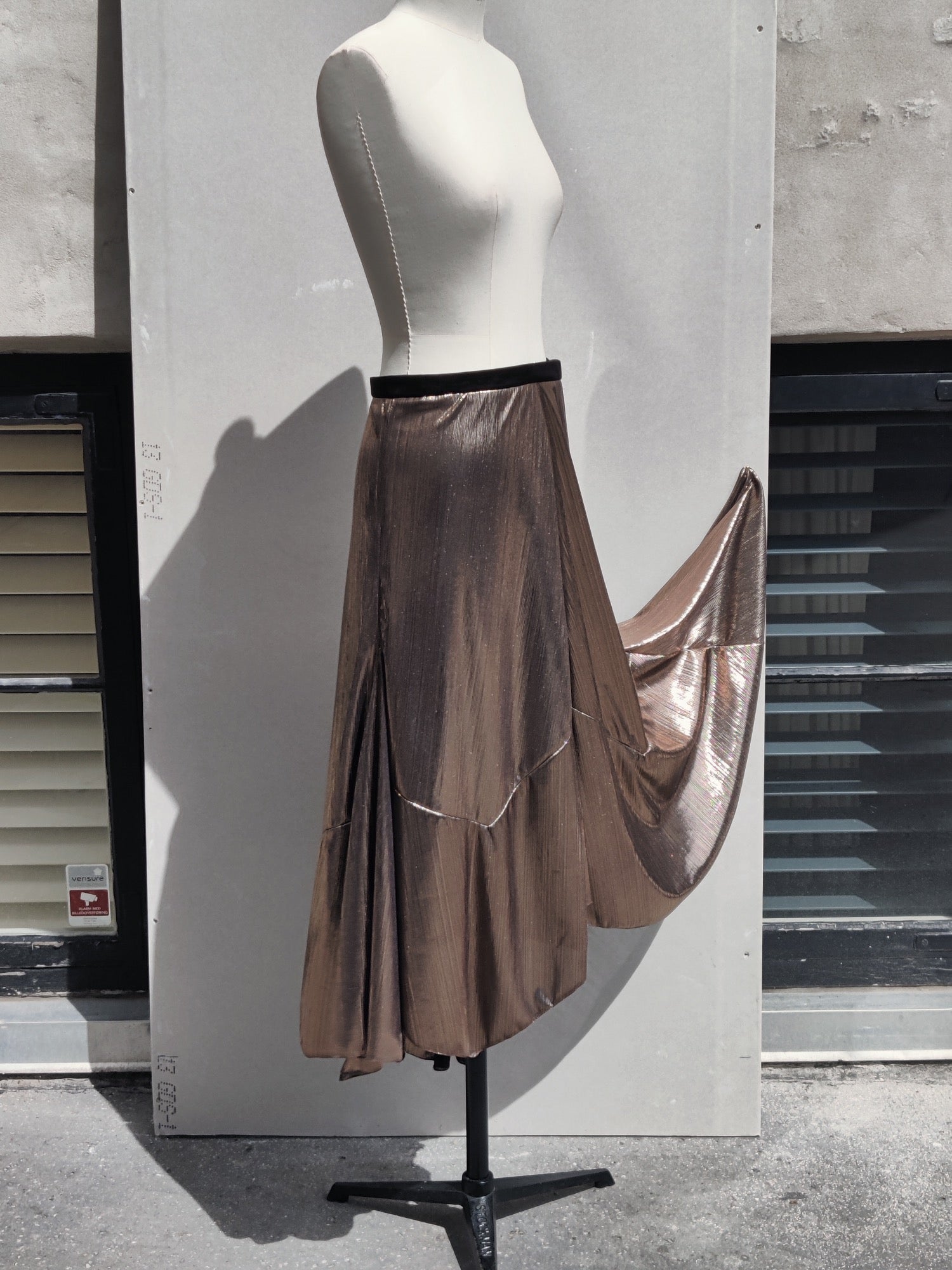 Alyza skirt bronze, side, on dummy. Pinned to show volume.