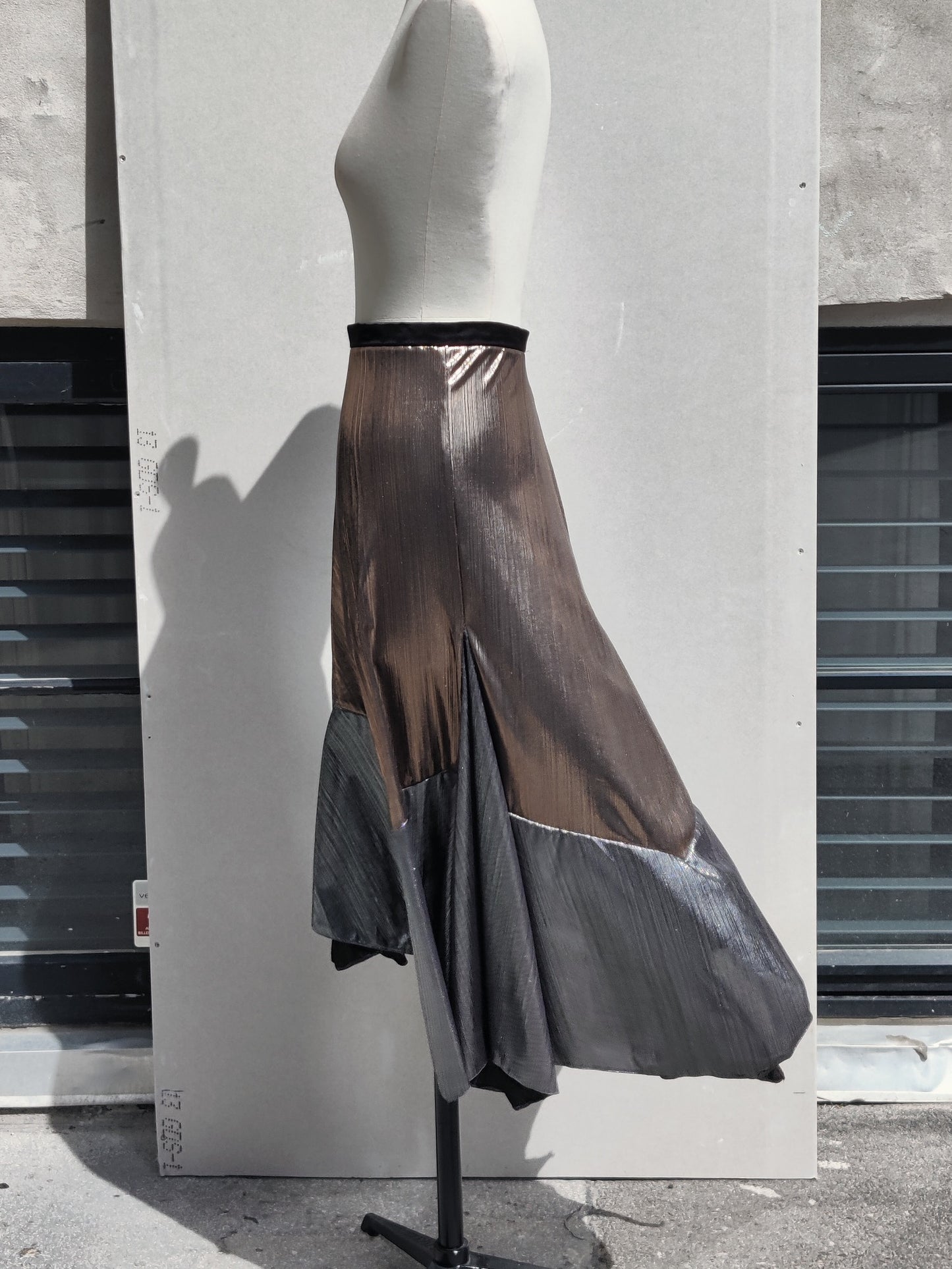 Alyza skirt bronze, side view, on dummy. Pinned to show volume.