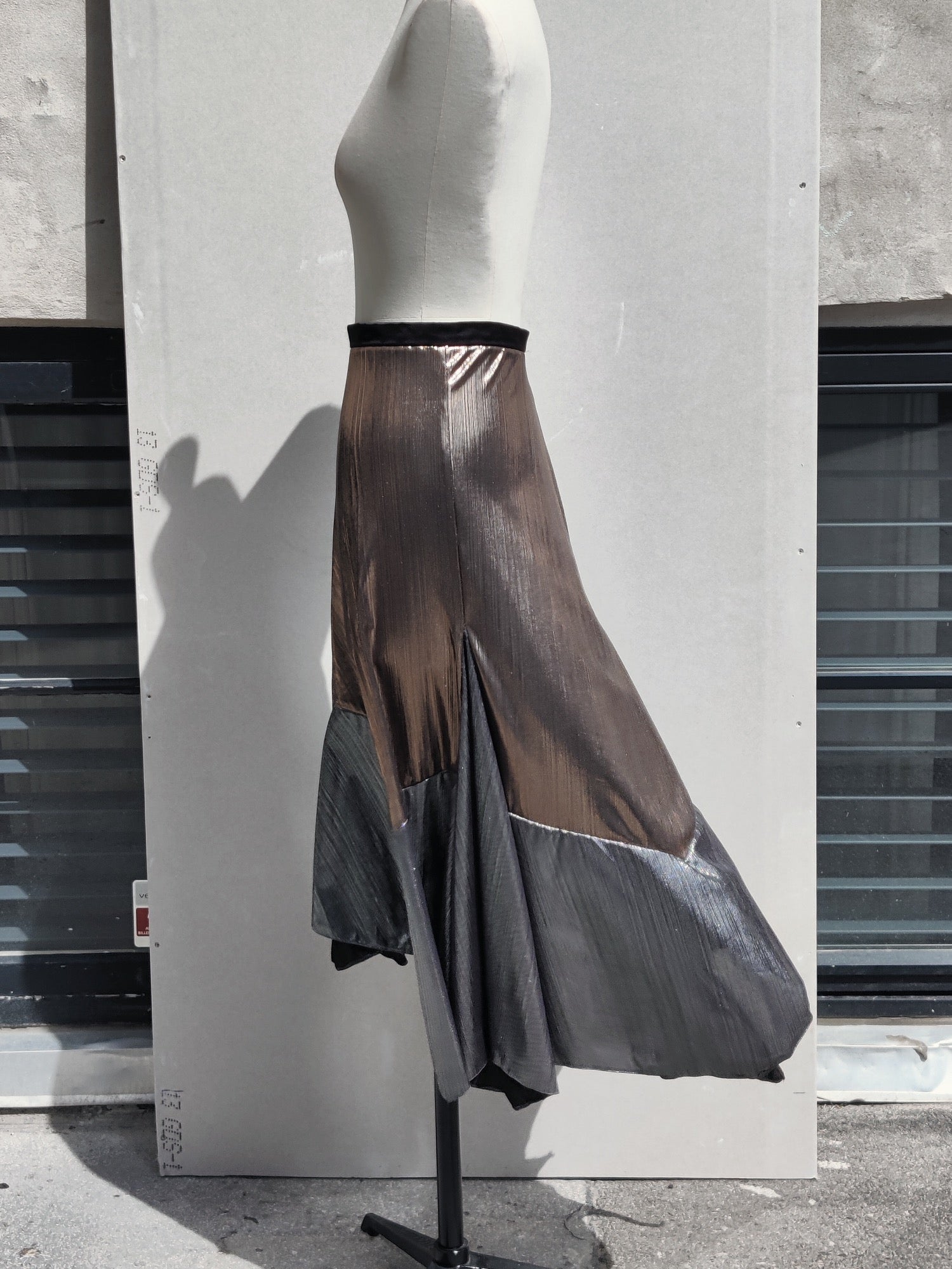 Alyza skirt bronze, side view, on dummy. Pinned to show volume.