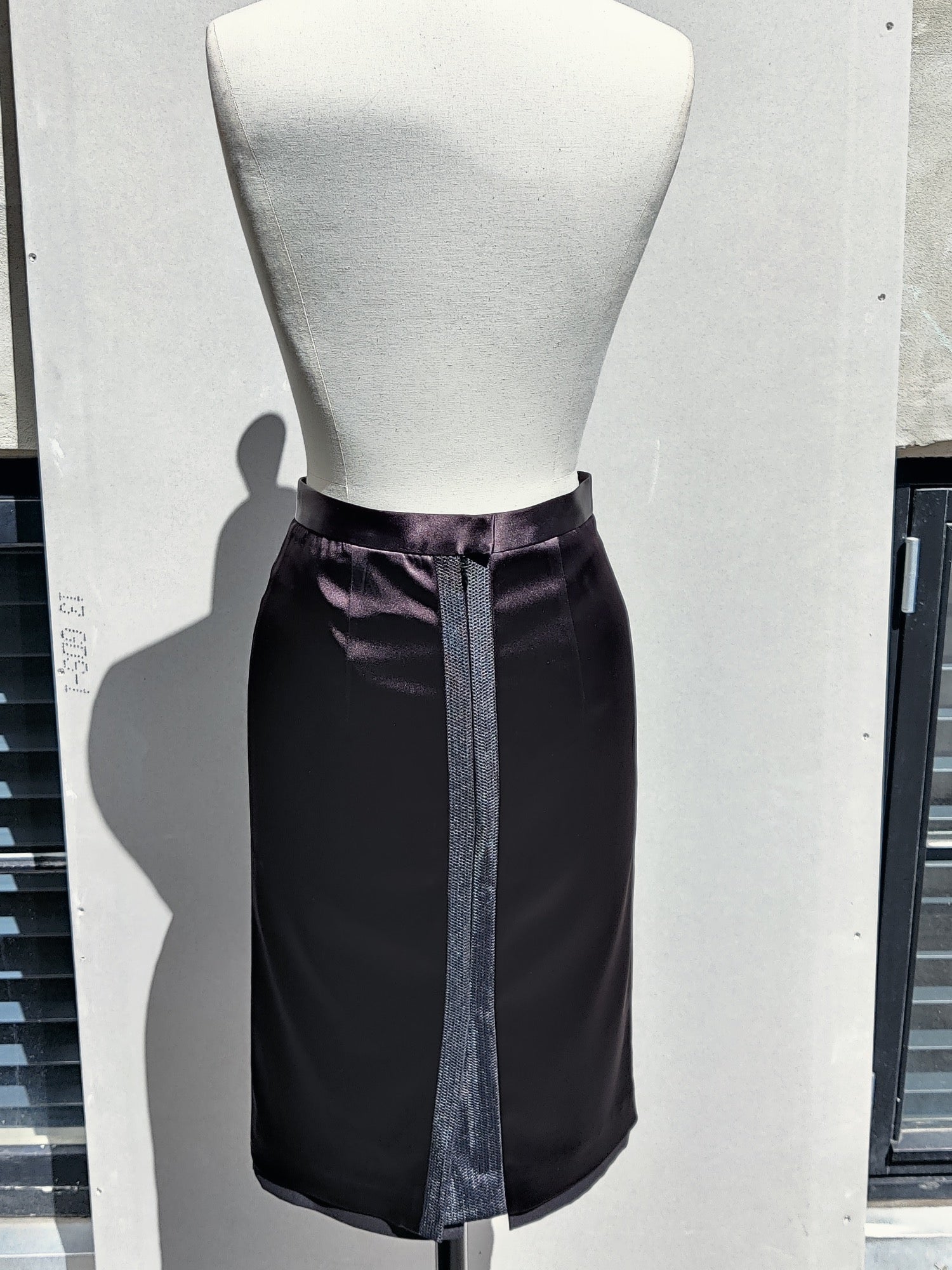 Back view: The Annouk pencil skirt has a classic center back split. .