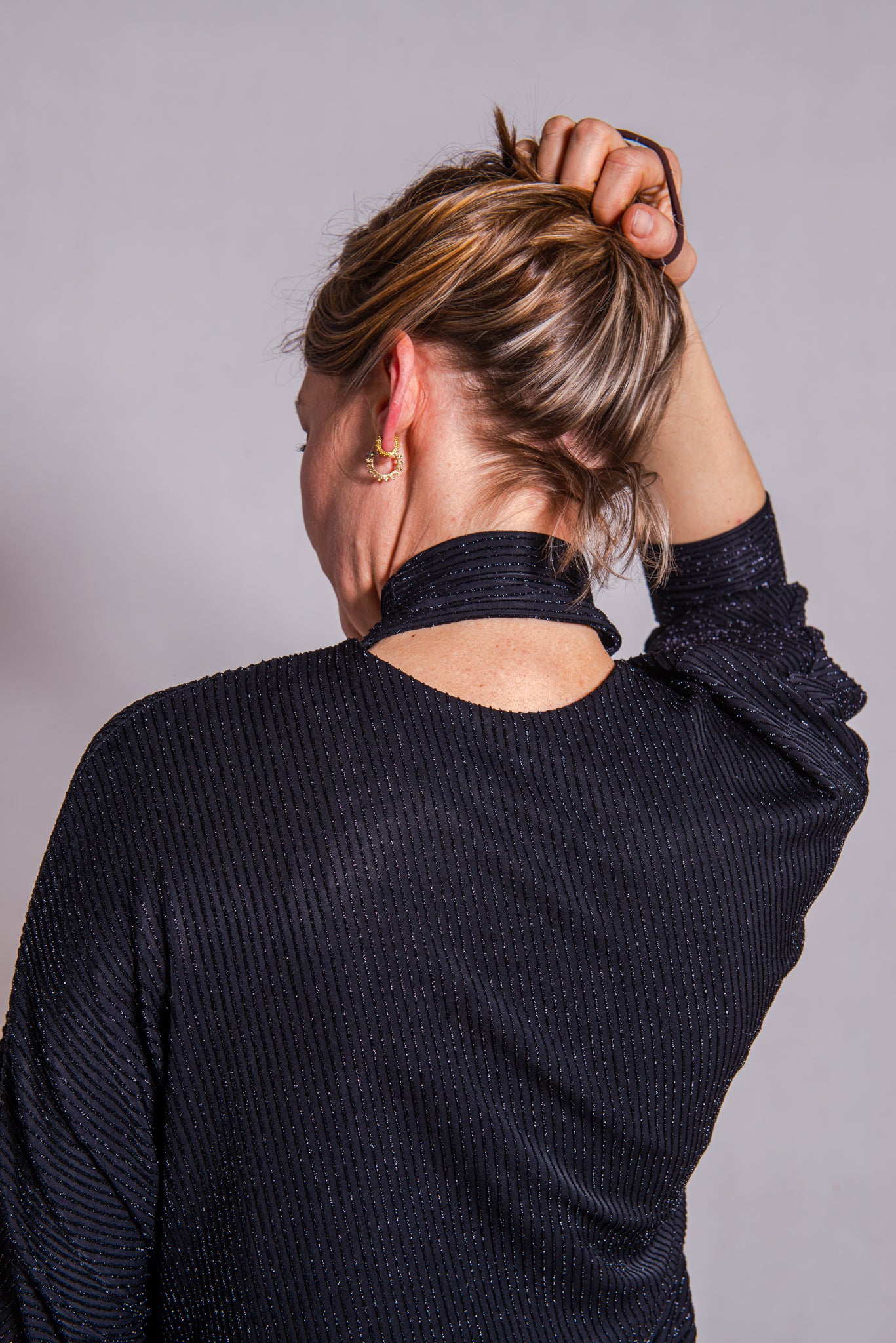 Woman wearing Adriana top - back.