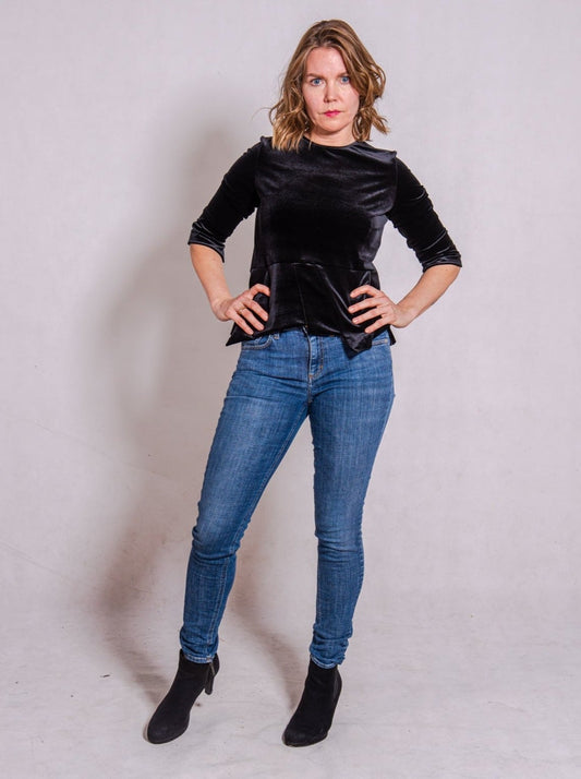 Model looking direct wearing Ann-Marie top, black, & own blue jeans.